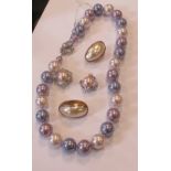 A tri-colour faux pearl necklace, each approx.1cm diameter, overall length approx. 42cm plus