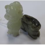 A jade carving of a man carrying a small child on his back, 5cm high, together with a jade carving