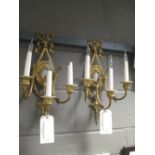 A pair of Adam style wall lights