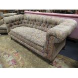 A paisley upholstered Chesterfield button back sofa and matching armchair (2)