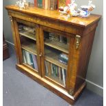 A mid-Victorian figured walnut vitrine in the French style, with marquetry inlays and gilt brass