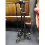 A set of wrought iron fire irons, various brassware etc