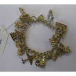 A charm bracelet with heart shaped padlock clasp hallmarked for 9ct gold, set with approximately