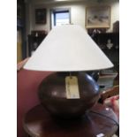 A large hammered copper lamp with cream shade together with a cream painted pine mirror and a pine