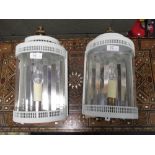 A pair of painted wall lanterns