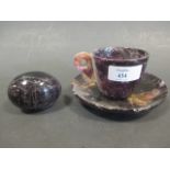 A blue john cup, saucer (glued together) and an egg hand warmer