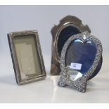 Various silver topped glass bottles, glass jugs, picture frames etc