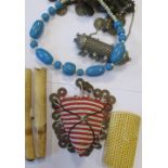 Two 19th century marine tusks, together with other bone and ivory items, beaded necklace, an African