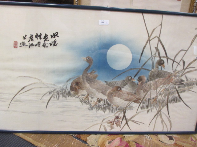 A Japanese silkwork picture of geese, framed, a printed diarama on fabric and one other scroll