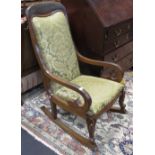 A Floral Green Re-upholstered Rocking Chair on Claw-and-Ball Feet