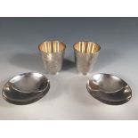 Sigvard Bernadotte for Georg Jensen, a pair of Danish metalwares beakers, pattern No. 819, each with