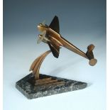 An Art Deco style bronze aeroplane desk ornament, the twin prop plane to a stepped lozenge base
