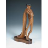 Attributed to Hagenauer, a carved wood figure of a Matador, the stylised figure stands in profile,