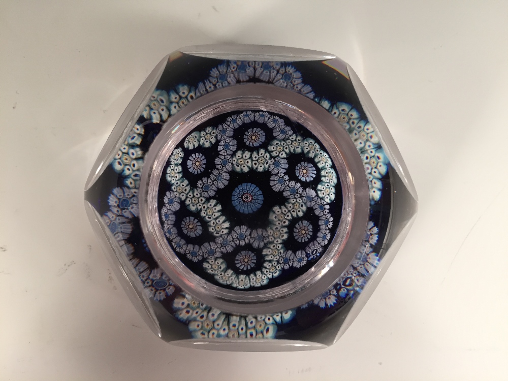 A Whitefriars millefiori glass paperweight, the facet cut weight with garlands of millefiori, 1975