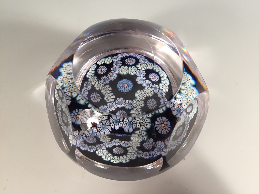 A Whitefriars millefiori glass paperweight, the facet cut weight with garlands of millefiori, 1975 - Image 2 of 2