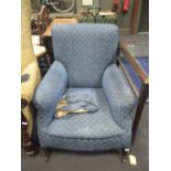 A blue upholstered armchair