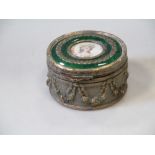 A circular brass and enamelled dressing table box, with female portrait to the lid