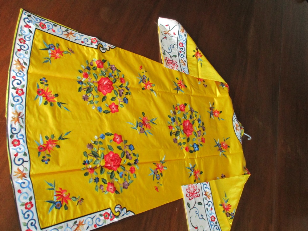 A Chinese lady's silk yellow ground robe embroidered with coloured flowers, the length from collar - Image 4 of 4