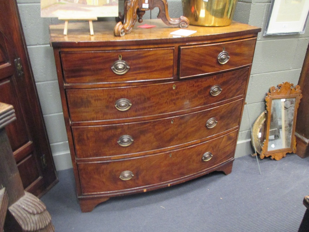 A George III bowfront mahogany chest of drawers, 102 x 111 x 55cm