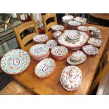 An early 19th century part dinner service, some pieces damaged