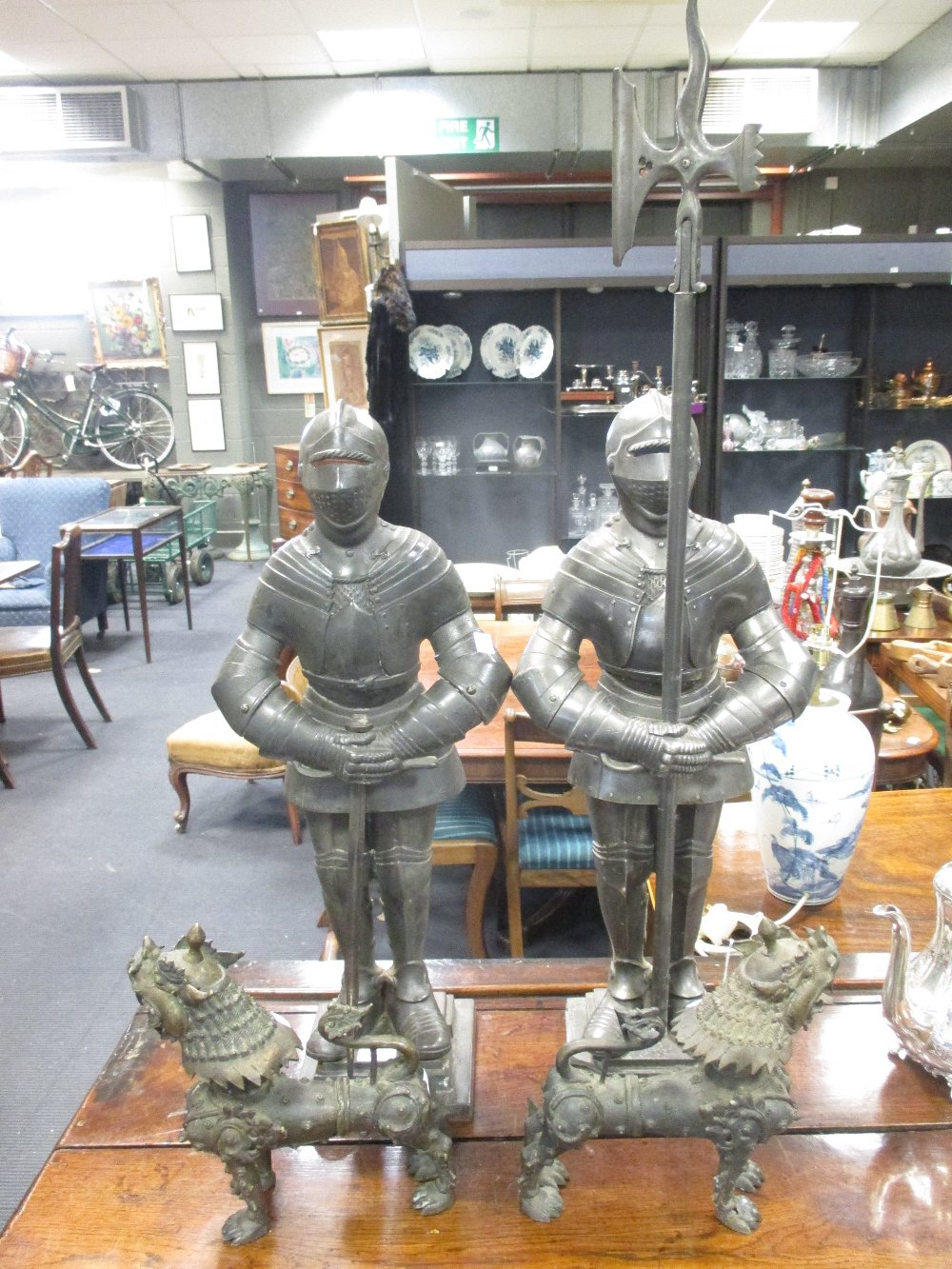 A pair of knights, lion dogs, Omani table lamp, (the knights, 94 cm max)