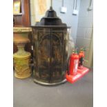 An 18th century black lacquer corner cupboard with painted decoration, 60cm wide, 125cm high