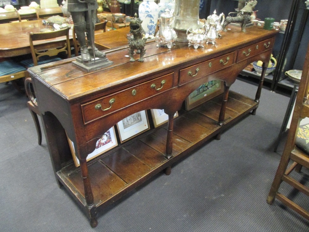 An 18th century oak dresser base with pot board, 204 cm wide, 90 cm high, 50 cm deep