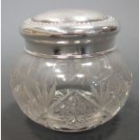 A modern silver wine coaster, London 1973, together with a silver lidded cut glass jar, the lid