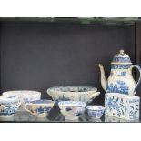 A collection of blue and white pearlware, to include a coffee pot, a strainer and two modern Delft