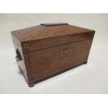 A Regency rosewood and brass inlaid sarcophagus shape tea caddy, on ball feet, lacking mixing bowl