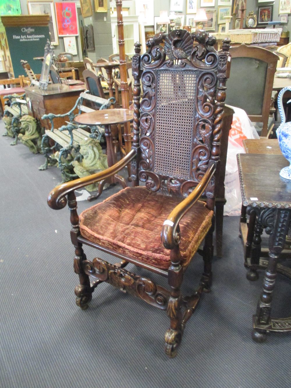 A pair of late 17th century style walnut open armchairs