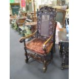 A pair of late 17th century style walnut open armchairs