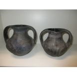 Two Chinese Neolithic grey pottery two handled vases, 16cm (6.5 in) and 18.5cm (7.25 in) high (2)