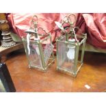 A pair of rectangular glass hanging lights