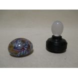 A Venetian scrambled cane paperweight and a French latticino egg ornament