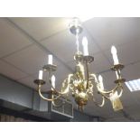 A brass eight branch chandelier electrolier