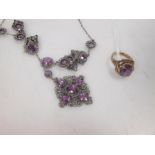 An amethyst fringe style necklace, the oval and round faceted amethsyts set in scrolling unmarked