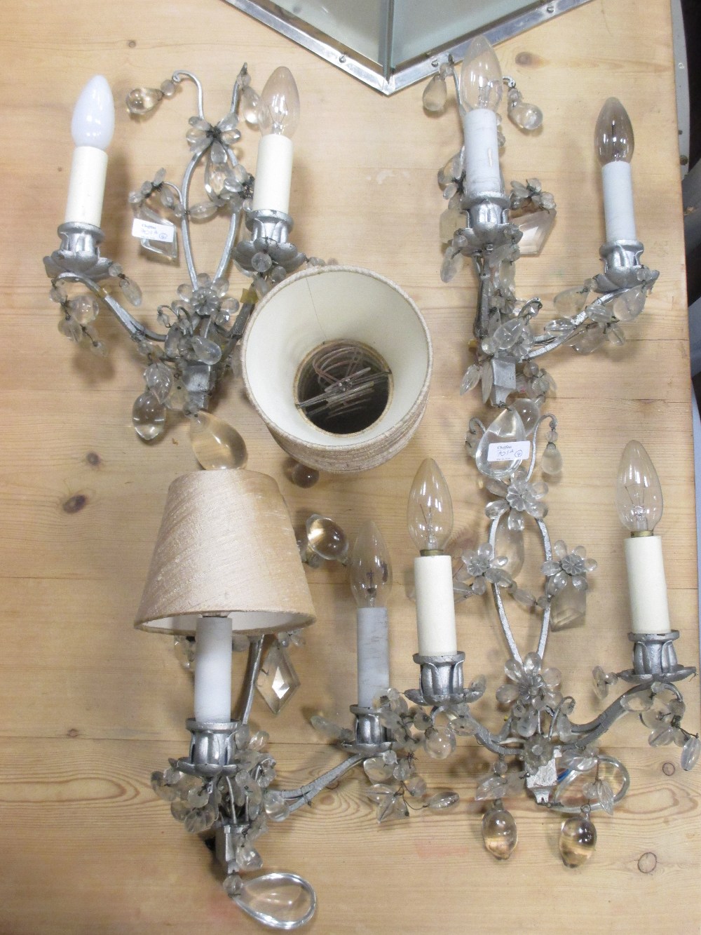 A set of four two branch wall lights