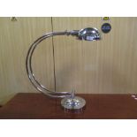 A large half moon shape Art Deco style desk lamp