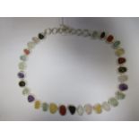 A multi-gemset necklace, the asymetrical rough crystals comprising of amethyst, citrine, rock
