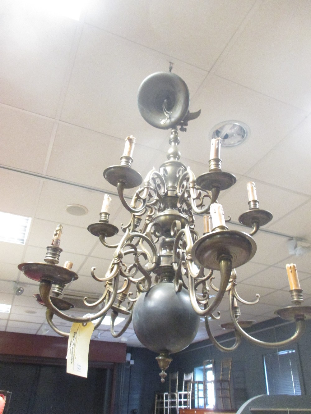 A large heavy brass Dutch style ceiling light with typically shaped branches
