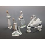 A quantity of Lladro to include a swan, three figures and three models of geese (7)