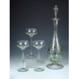 A Theresienthal glass decanter and three glasses, the former enamelled with fruiting strawberries,