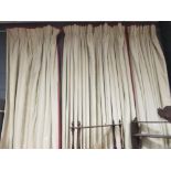 Two pairs of cream curtains with red trim, 315cm drop