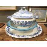 A blue and white willow pattern soup tureen and cover, a wash bowl and a large meat plate