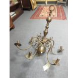 A brass Dutch type ceiling light with six branches