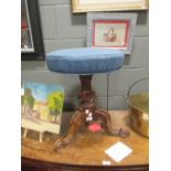 A Victorian carved walnut piano stool