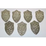 Seven white metal shields, unmarked miniature replicas of the Elcho Shield, a challenge trophy for