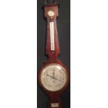 A Victorian mahogany wheel barometer, with silvered 10inch dial, signed to a level below 'A