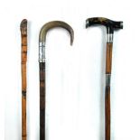 A late 19th century horn handled sword stick, the white metal collar with twist and lock